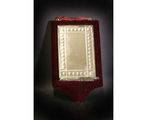 A sorcerer's mirror,early 20th century, the plate of rectangular form with a bevelled edge, with convex lenses along the edge