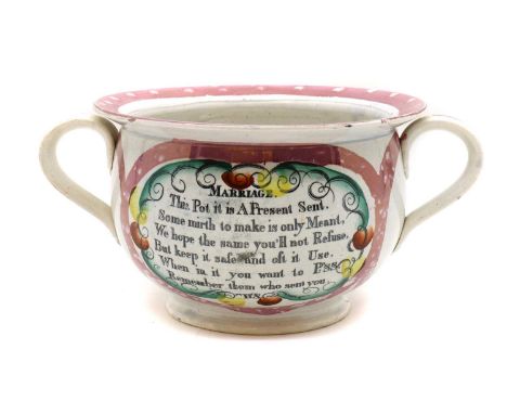 A Victorian Sunderland lustre chamber pot,of typical form, internally decorated with a seated cross-legged figure and a frog 