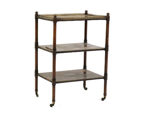 A Regency rosewood etagere,with gilt brass gallery top and two further shelves, split-round moulded border decoration, on tur