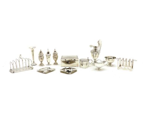 A collection of silver items,comprising two toast racks, the larger by Hukin &amp; Heath Ltd, Birmingham 1935, 13cm wide, the