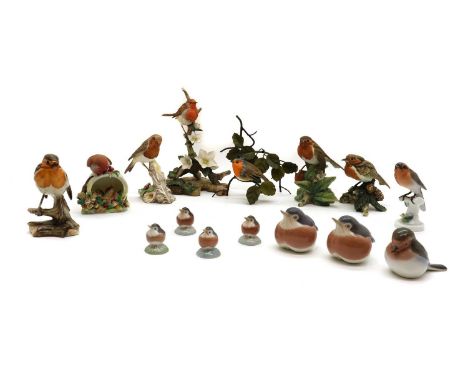 A collection of porcelain models of robins,20th century, comprising a pair by Royal Copenhagen, numbered 2266, 7.5cm high, a 