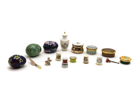 A collection of enamel pill boxescomprising two examples by Halcyon Days, the largest 2.5cm high, two examples by Bilston And