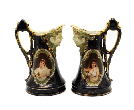 A pair of Austrian Alexandra porcelain wine ewers,19th century, of tapering form decorated in cobalt blue with gilt detailing