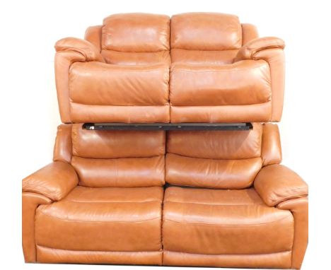 A tan leather sofa suite, comprising three seater and two seater sofa, each with manual recliners, the three seater 210cm wid