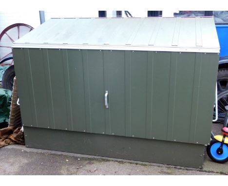 A metal log store, in a green and light green finish, with a lift hinged lid, 137cm high, 184cm wide, 89cm deep, and rubber g