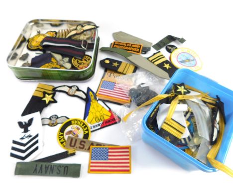 A group of military shoulder and breast badges, US Army and UK Army. (two tins)