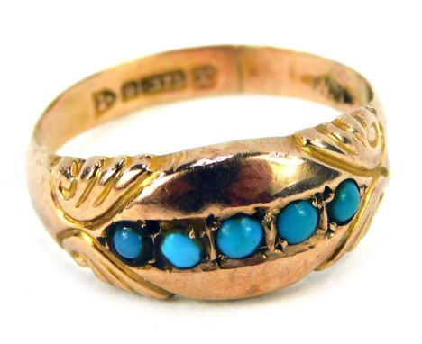 A 9ct gold turquoise dress ring, the panel design set with five turquoise, with scroll design shoulders, late Victorian/early