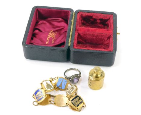 A silver and amethyst set dress ring, a miniature brass scale, and a French brass and enamel bracelet depicting Paris landmar