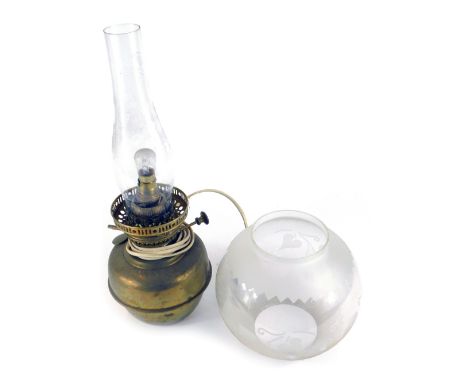 A 20thC brass oil lamp, converted to electricity, with a fluted rim, on brass base, glass chimney and clear glass shade, 43.5