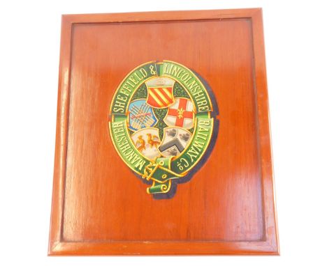 Railway interest, a mahogany panel printed with the Arms and Garter of the Manchester, Sheffield, and Lincolnshire Railway Co