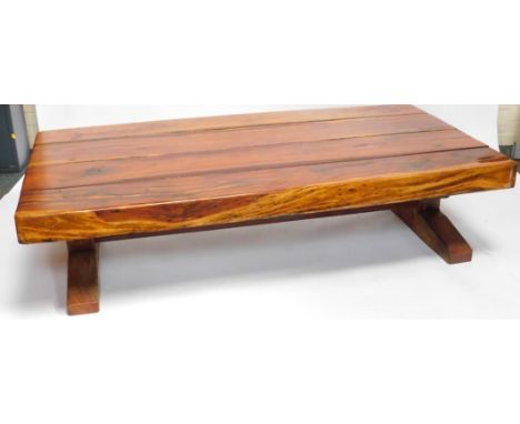 A solid oak rectangular coffee table, with four panel top, 44cm high, 180cm wide, 90cm deep.