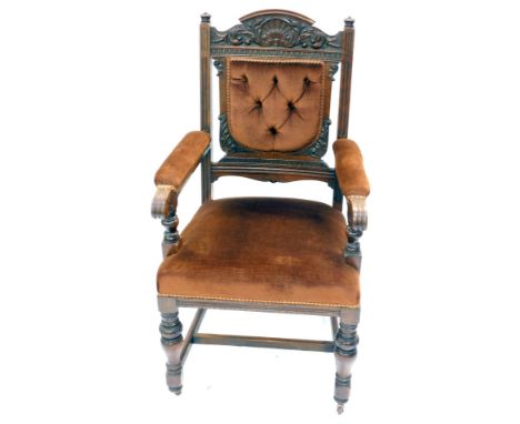 A Victorian oak open armchair, with shell and foliate carved crest rail, button back and seat upholstered in brown draylon, r