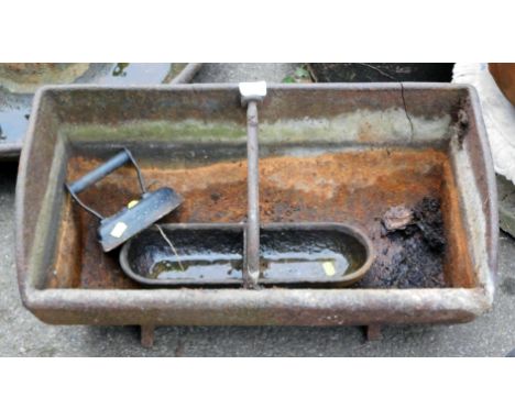 A wrought iron animal feeder, 30cm high, 63cm wide, 34cm deep, a smaller trough, 37cm wide, 12cm deep, and a metal iron. (3) 