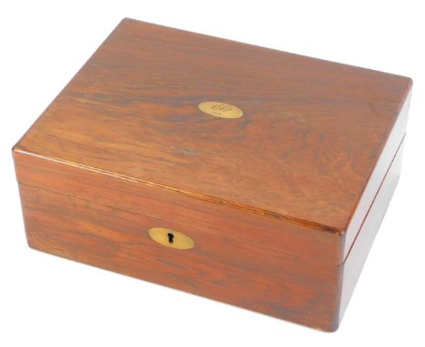 A Victorian mahogany writing box, with brass escutcheon and presentation plaque bearing the initials CJJ 1874, opening to rev