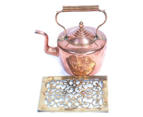 A Victorian copper kettle, 33cm high, and a brass pierced brass teapot stand, 28cm x 21cm. (2) 