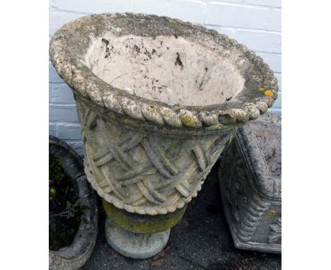 A 19thC reconstituted stone planter, the planter with cross hatched design, on a small circular base, 65cm high. 