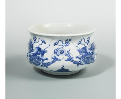 A Kangxi bowl, painted with two dragons head to head with sacred pearl, 22cm diameter  Some restoration at the rim.