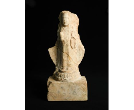 A white marble figure of a standing Bodhisattva, Eastern Wei Dynasty, dated 543, Guanyin wears a three-leaf crown, smiling ro