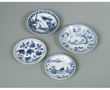 Four saucers from Kangxi period, the first painted with two chickens within radiating panels, 11.5cm diameter, the second pai