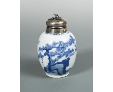 A Kangxi silver topped and mounted ovoid blue and white jar, painted with figures by rocks and a pine tree, having "Ming Chen