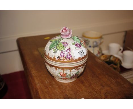 A Sampson porcelain bowl and cover having famille rose decoration and floral finial