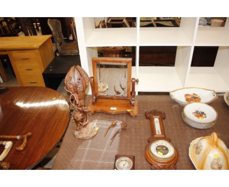 A Victorian swing toilet mirror; an oak cased thermometer barometer by A&amp;W Hubbard Carr Street Ipswich; and a carved orie