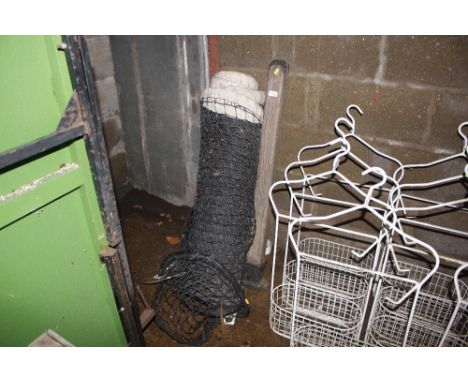 A pair of vintage tennis posts and net