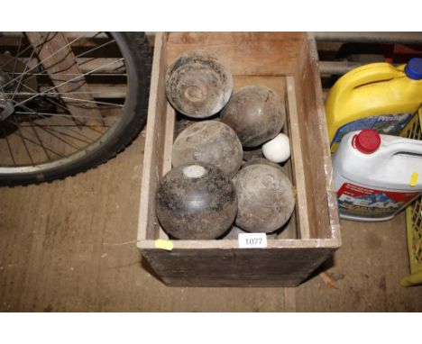 A quantity of old bowling woods and ceramic jack balls