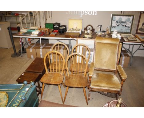 A set of four light Ercol stick back kitchen chairs 