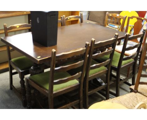 A draw leaf refectory style dining table; and six ladder back chairs 