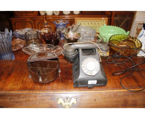 A vintage Bakelite telephone - ear piece AF; and a Bakelite revolving desk tidy