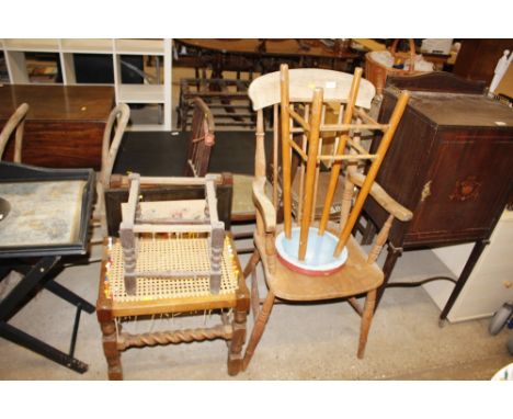 An elm stick back elbow chair; a circular wooden stool; a cane seat stool; a stool frame; a folding table; and an embroidered