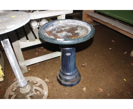 A ceramic bird bath