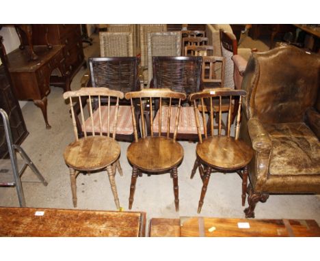 Three Edwardian elm seated stick back kitchen chairs 