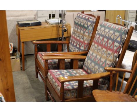 A pair of wooden framed armchairs with tapestry seats 