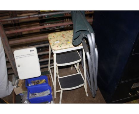 A step stool; and a folding chair 