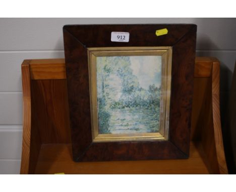 A rural print in burr wood frame