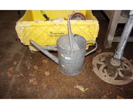 A vintage galvanised watering can
