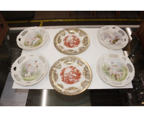 Four late Victorian pierced porcelain dessert plates decorated cherubs and maidens; and a pair of Wedgwood "Festoon" cabinet 