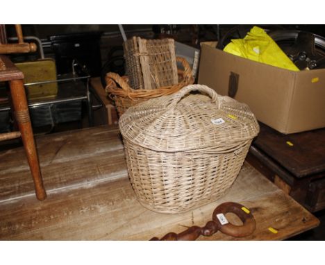 A wicker lidded basket; a small wicker hamper and a log basket