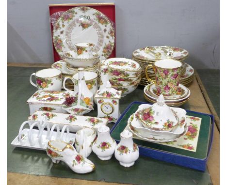 A box of Royal Albert Old Country Roses, three tier cake stand, mugs, bowls, four dinner plates, seven side plates, table mat
