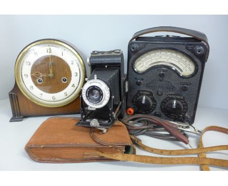 A GRF Cope &amp; Co. of Nottingham mantel clock, a voltmeter and a Brownie folding camera 