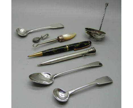 A pair of silver mustard spoons, one other silver spoon, a silver sifter spoon, a/f, a button hook, a clip and two pencils 