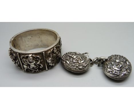 An eastern white metal bangle and a cloak clasp 