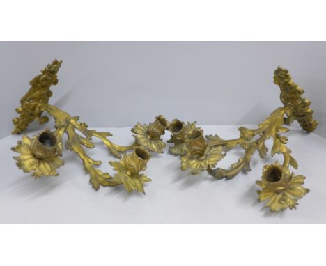 A pair of Victorian gilded three branch candelabra 