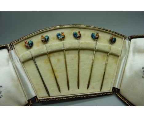 A cased set of six silver and enamel cocktail sticks, Birmingham 1934 