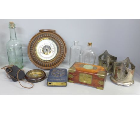 A barometer, a Westminster Bank cash tin, a Russian monocular, a Chinese wooden chest, three bottles, two wine coasters, etc.