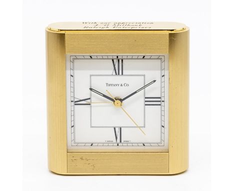 A Tiffany &amp; Co brass alarm clock; and a Estyma travel clock (2)