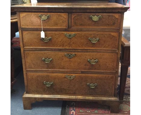 A George I and later walnut chest of drawers, the carcase probably 20th Century in date with a quarter veneered top and sides