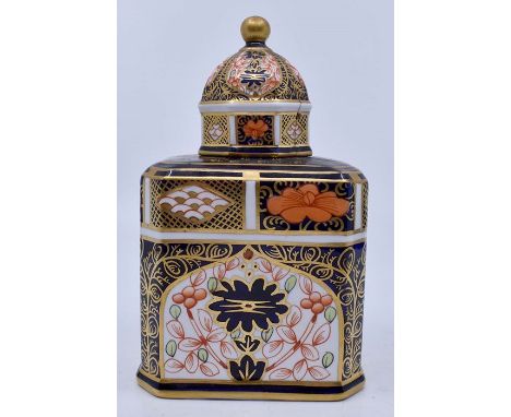 A Royal Crown Derby Imari tea caddy and domed cover, red mark patter no: 1768/1128 B together with two RCD Imari 1128 lunch p